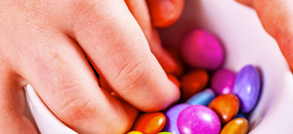 Child's hand with sweets