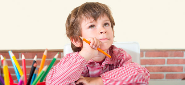 Child at desk paying attention