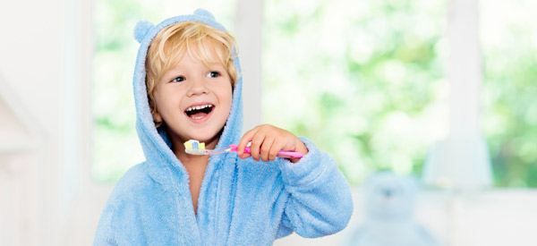 Child holding a toothbrush