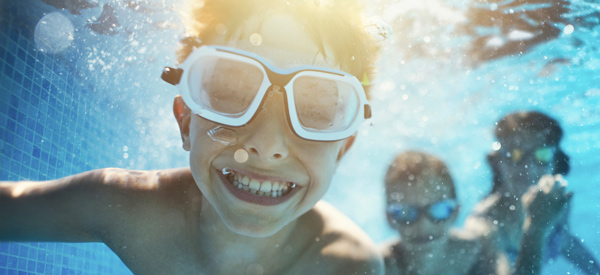 Boy swimming under water